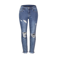 Woman ripped slim fit casual jeans